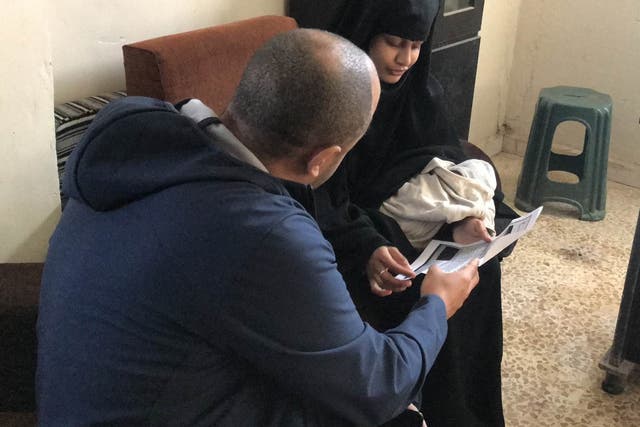 Shamima Begum being shown a copy of the Home Office letter which stripped her of her British citizenship by ITV News security editor Rohit Kachroo