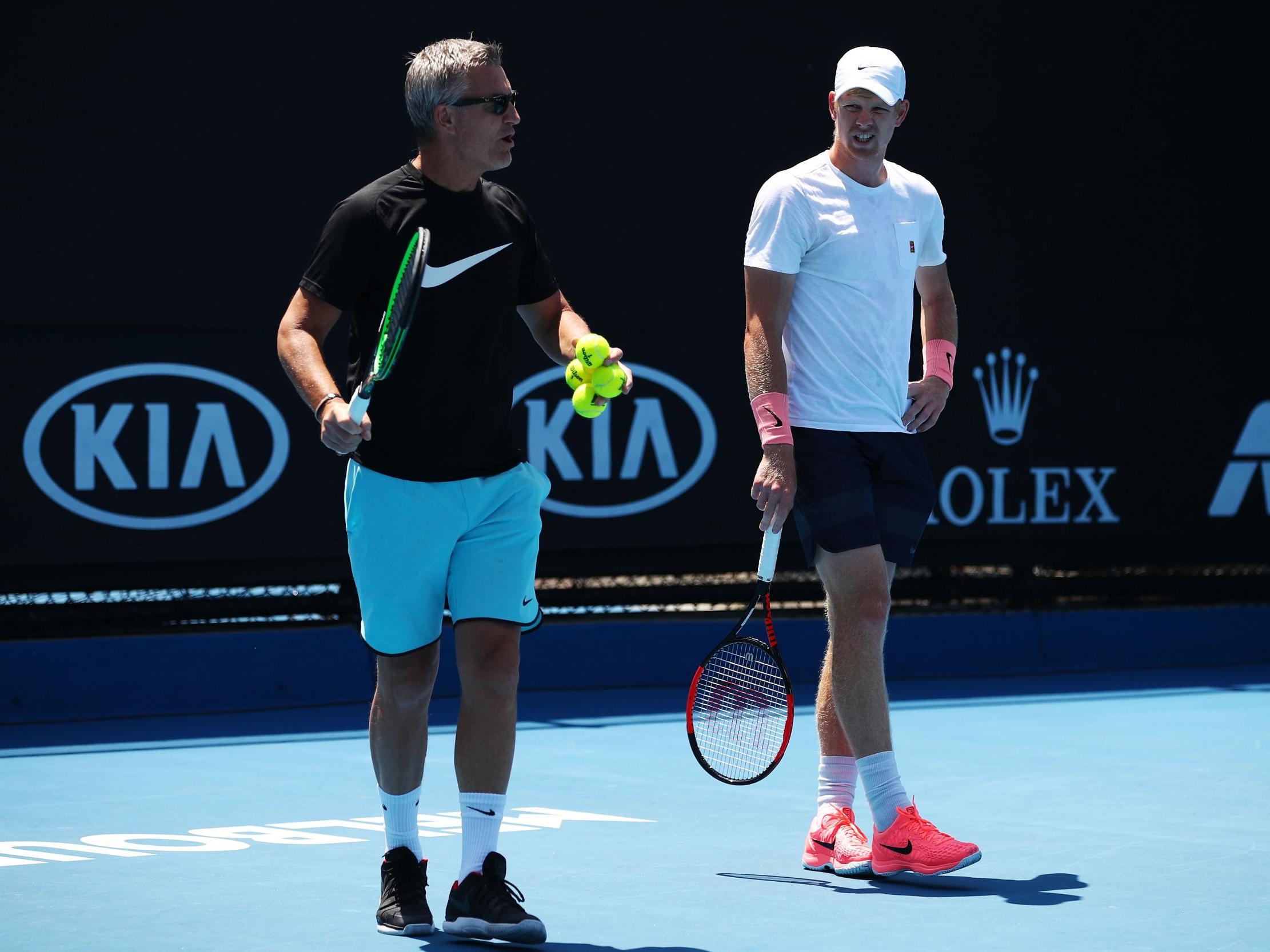 Coach Fredrik Rosengren is seen working with Kyle Edmund of Great Britain