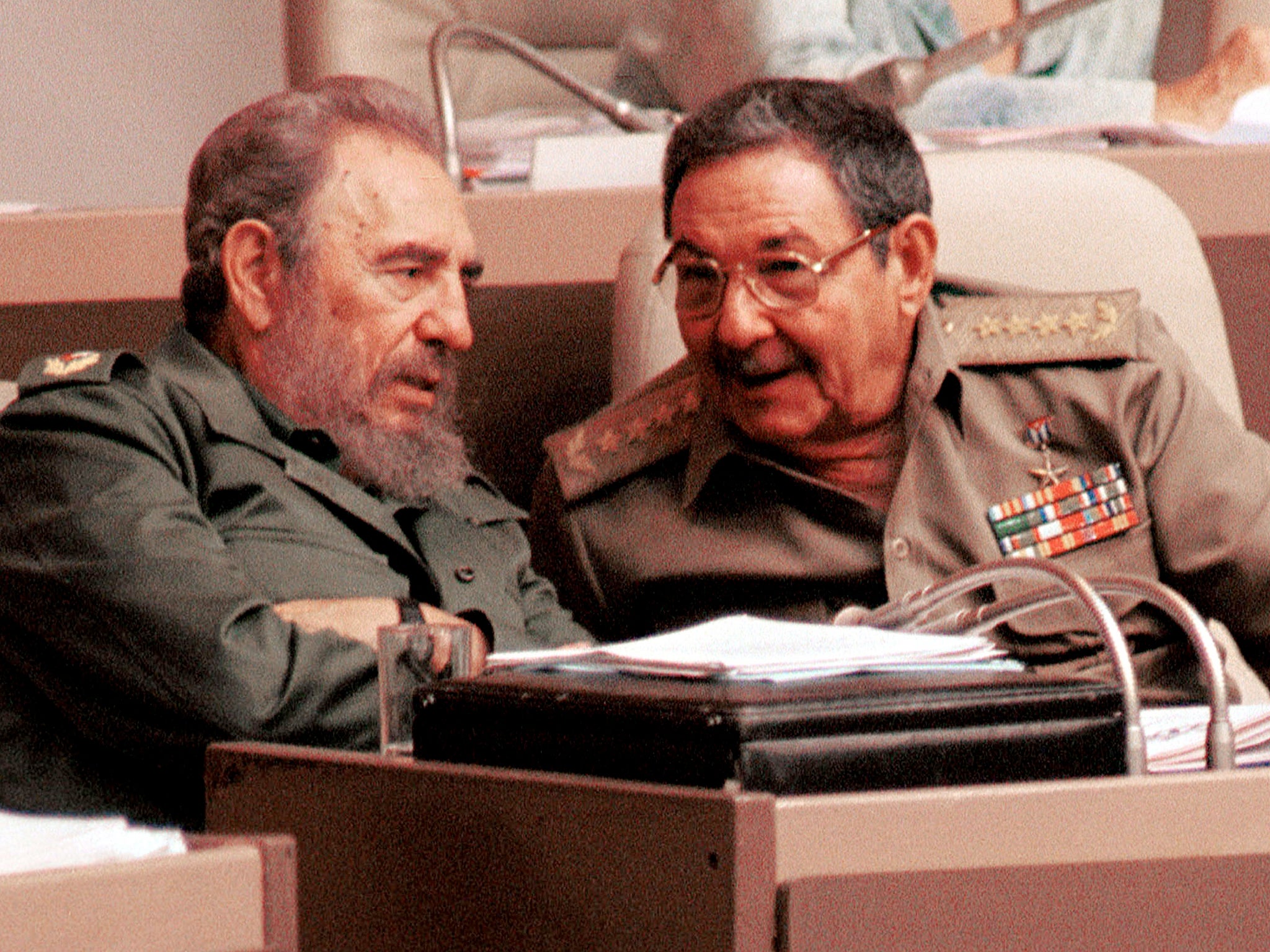 Fidel Castro and his brother?Raul?speak during a session of the National Assembly legislature in Havana, Cuba in 2001