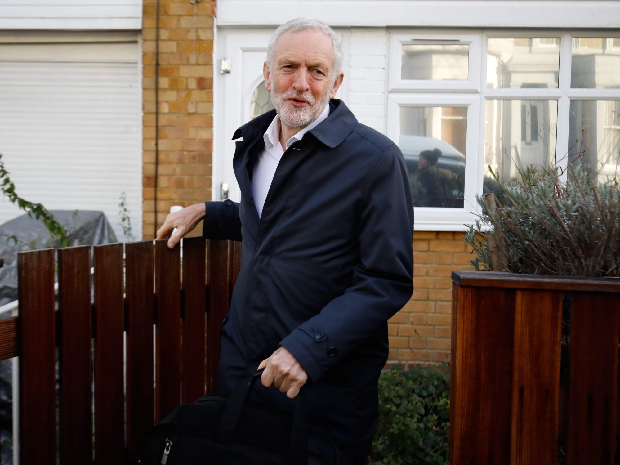 Jeremy Corbyn leaving his house to attend PMQs