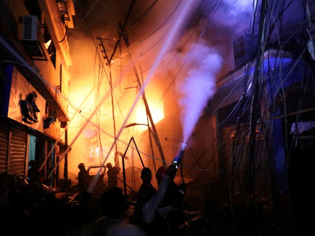 Firefighters at the scene of a blaze that broke out at a chemical warehouse in Dhaka, Bangladesh