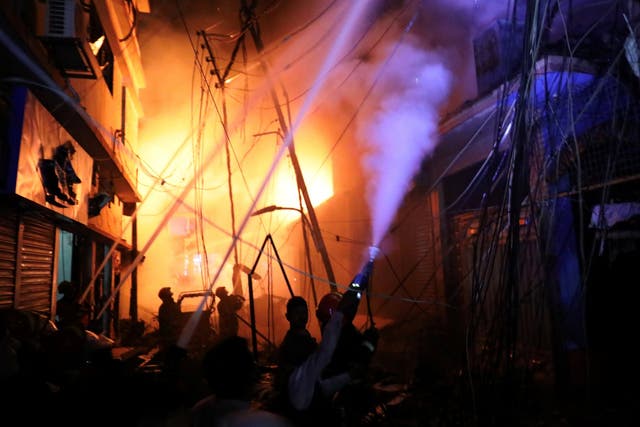 Firefighters at the scene of a blaze that broke out at a chemical warehouse in Dhaka, Bangladesh