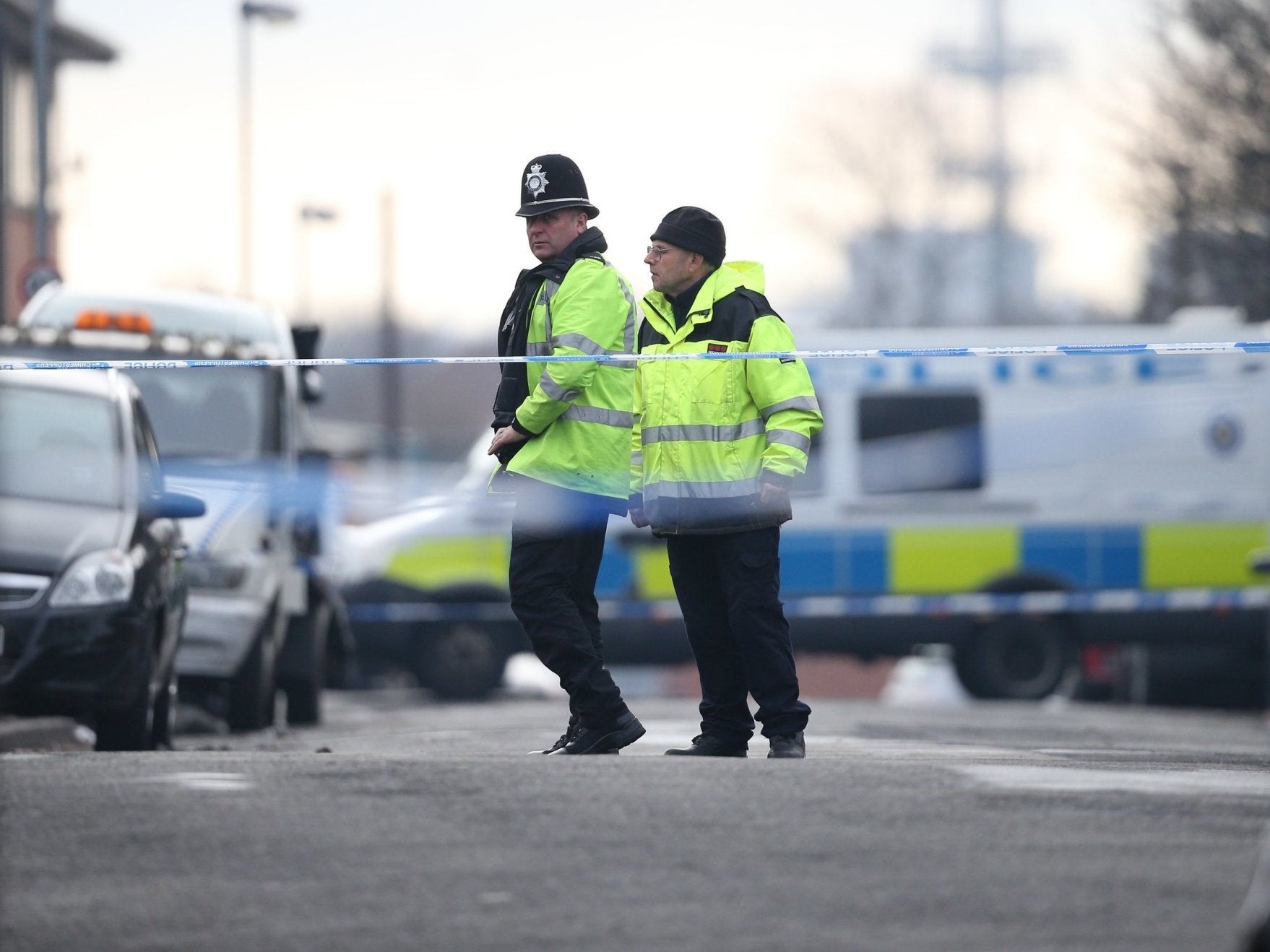 Officers at the scene where the teenager was killed.