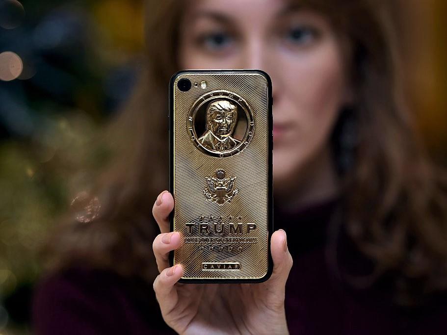 A gold-plated phone case by a Russian-Italian company, bearing the likeness of Donald Trump - at a minimum price of 197,000 rubles (£2,500 euros) - in Moscow on 14 November, 2016