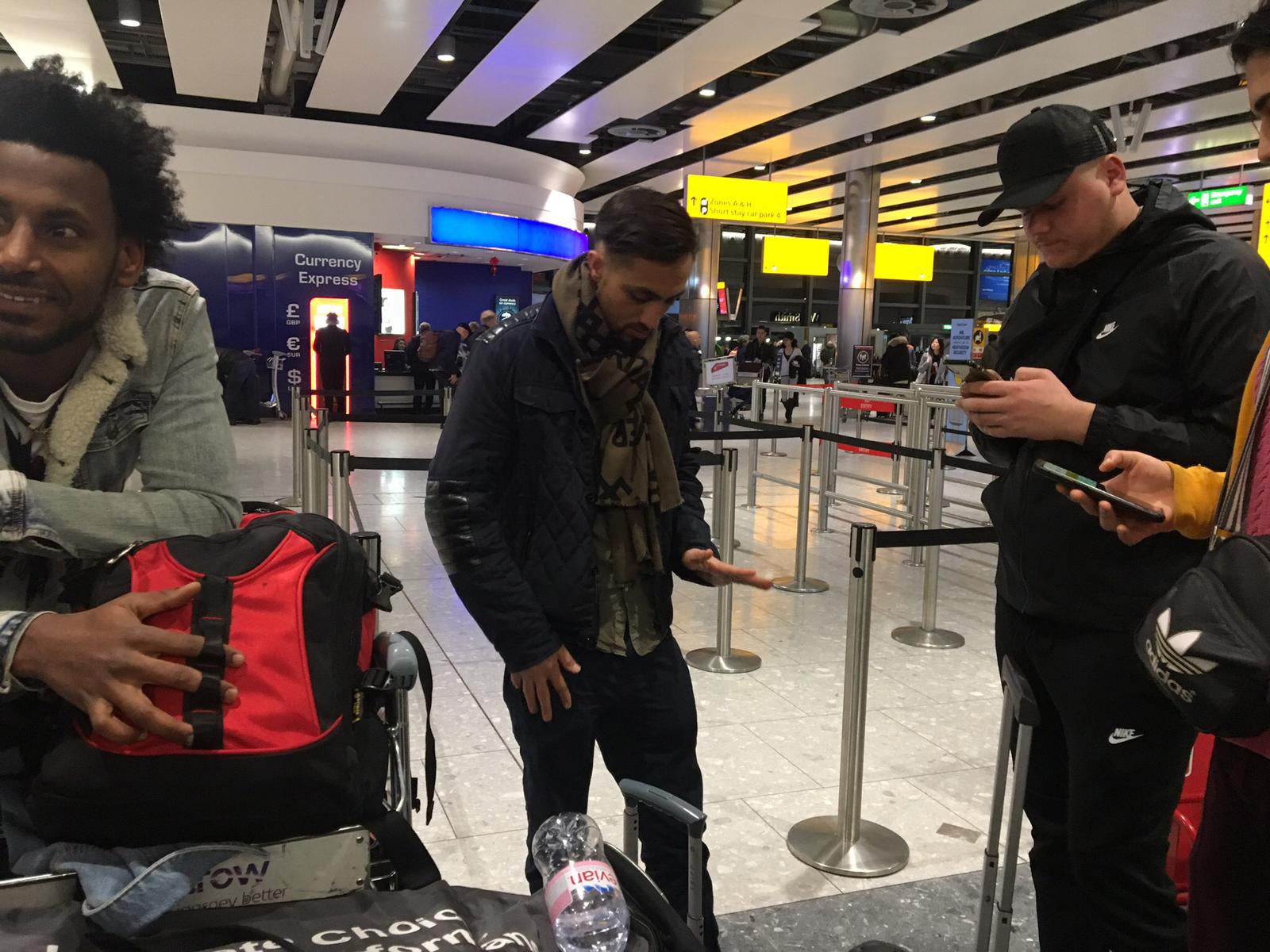 Syed Haleem Najibi and fellow actors wait at Heathrow having been barred from flying