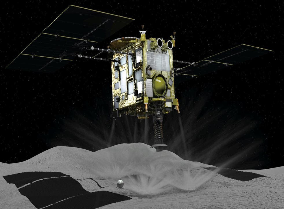 A computer graphic handout image shows Japan Aerospace Exploration Agency's Hayabusa 2 probe touches down on an asteroid, in this image released by Japan Aerospace Exploration Agency