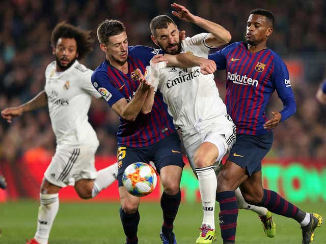 Karim Benzema battles for the ball in the clasico