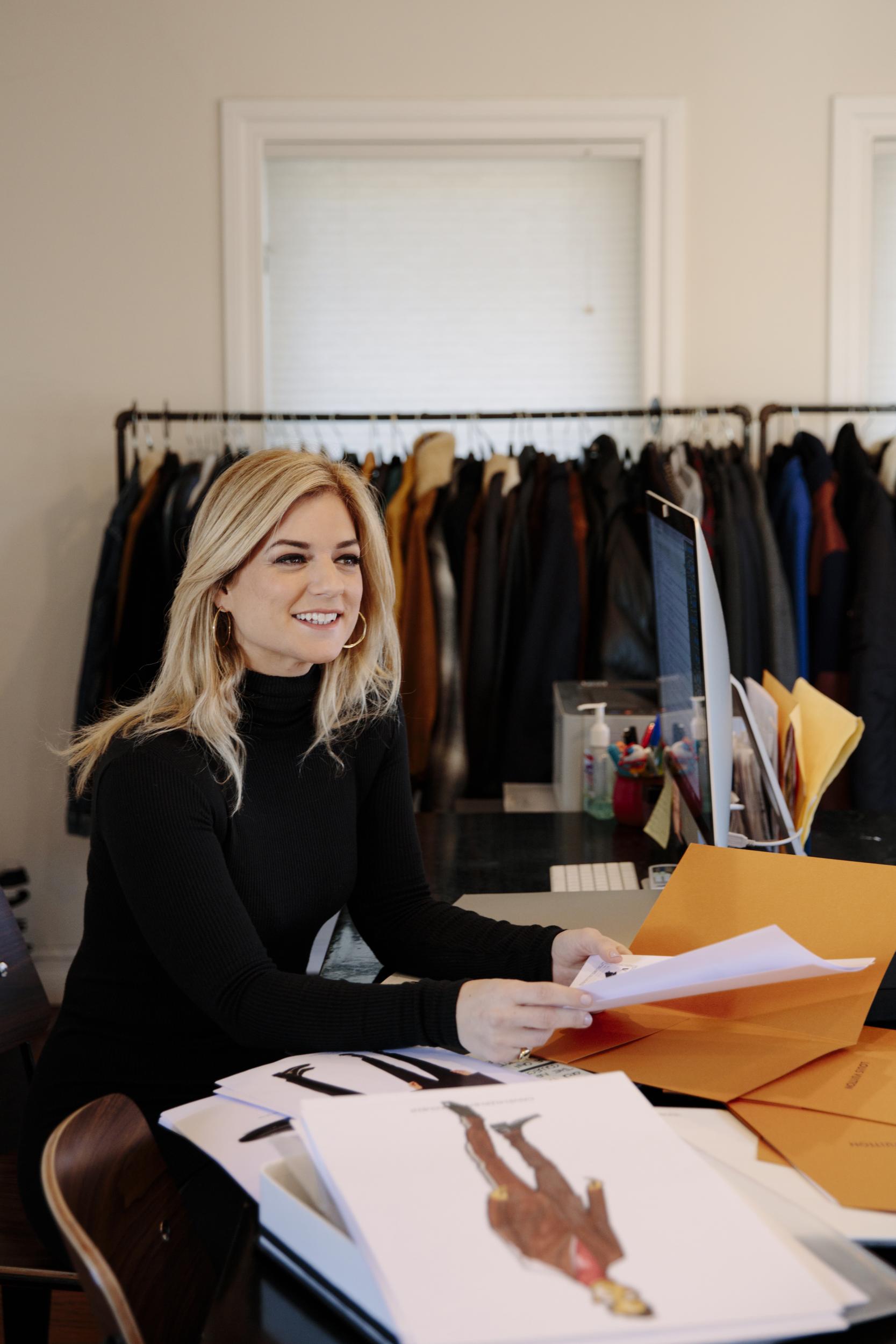 Ilaria Urbinati looks through proposed red carpet looks for her clients in her Los Angeles studio.