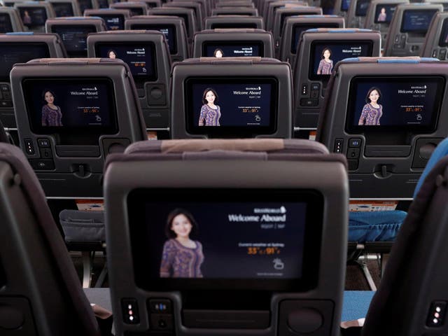 In-flight entertainment screens are pictured in an economy-class cabin of a Singapore Airlines A380