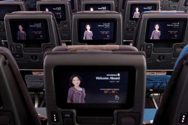 In-flight entertainment screens are pictured in an economy-class cabin of a Singapore Airlines A380