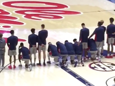 Basketball players kneel during anthem to protest Confederate march