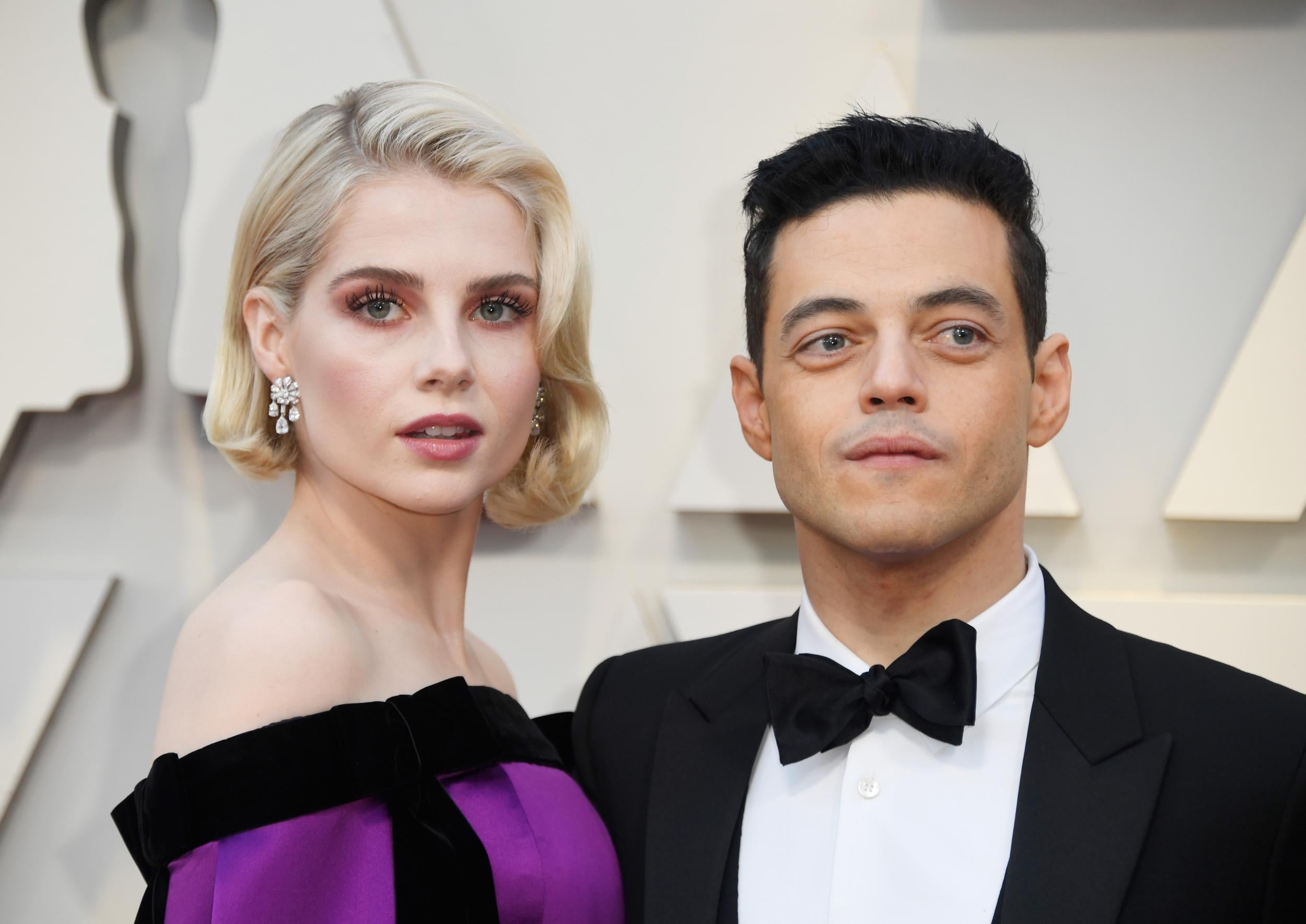 Rami Malek and Lucy Boynton walk Oscars 2019 red carpet together.