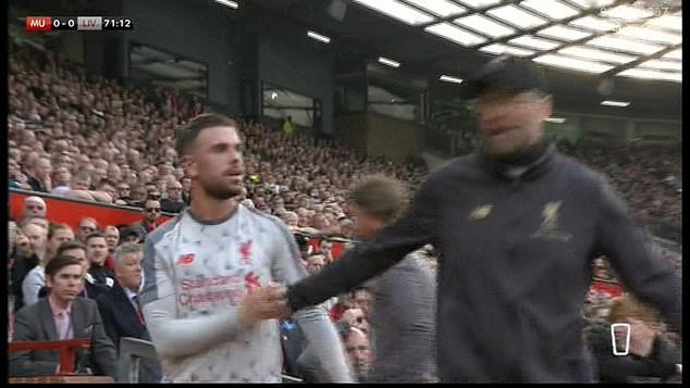 Henderson then appeared to pull away from the handshake