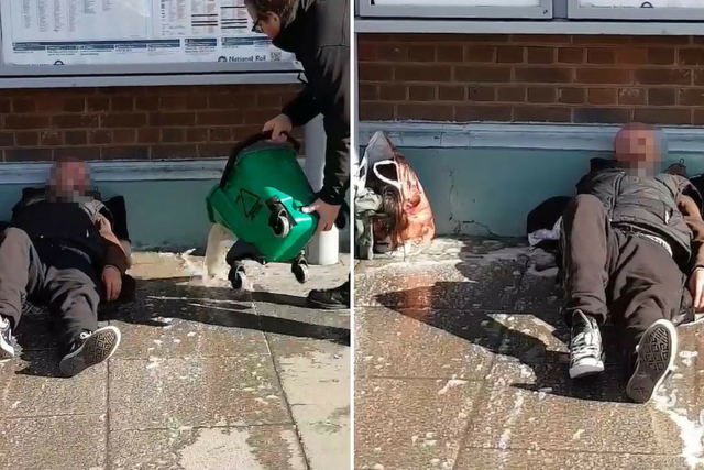 Two Southern Railway workers have been suspended after a bucket of water appeared to be thrown towards a homeless man lying on the ground outside Sutton railway station in southwest London on 21 February 2019.