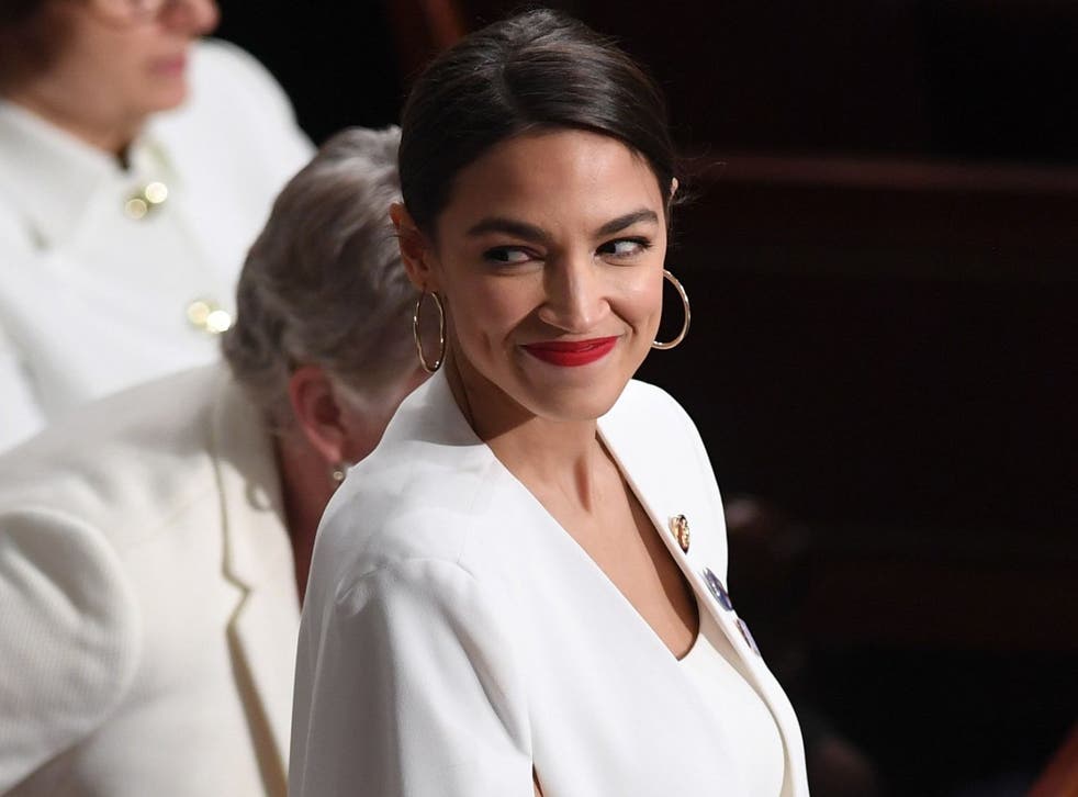 US Representative Alexandria Ocasio-Cortez (D-NY), dressed in white in tribute to the women's suffrage movement, arrives for the State of the Union address at the US Capitol in Washington, DC, on February 5, 2019.