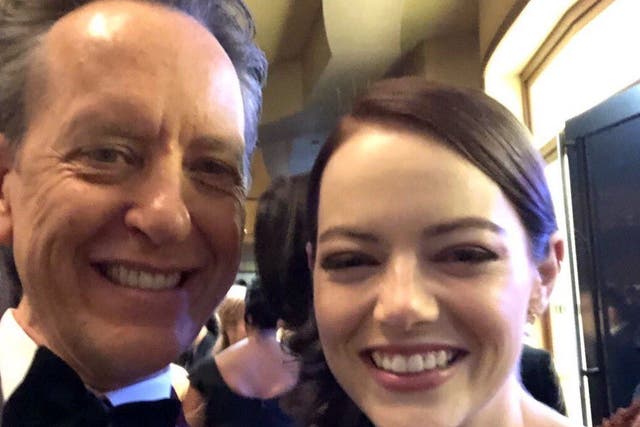Richard E. Grant takes a selfie with Emma Stone at the 2019 Academy Awards