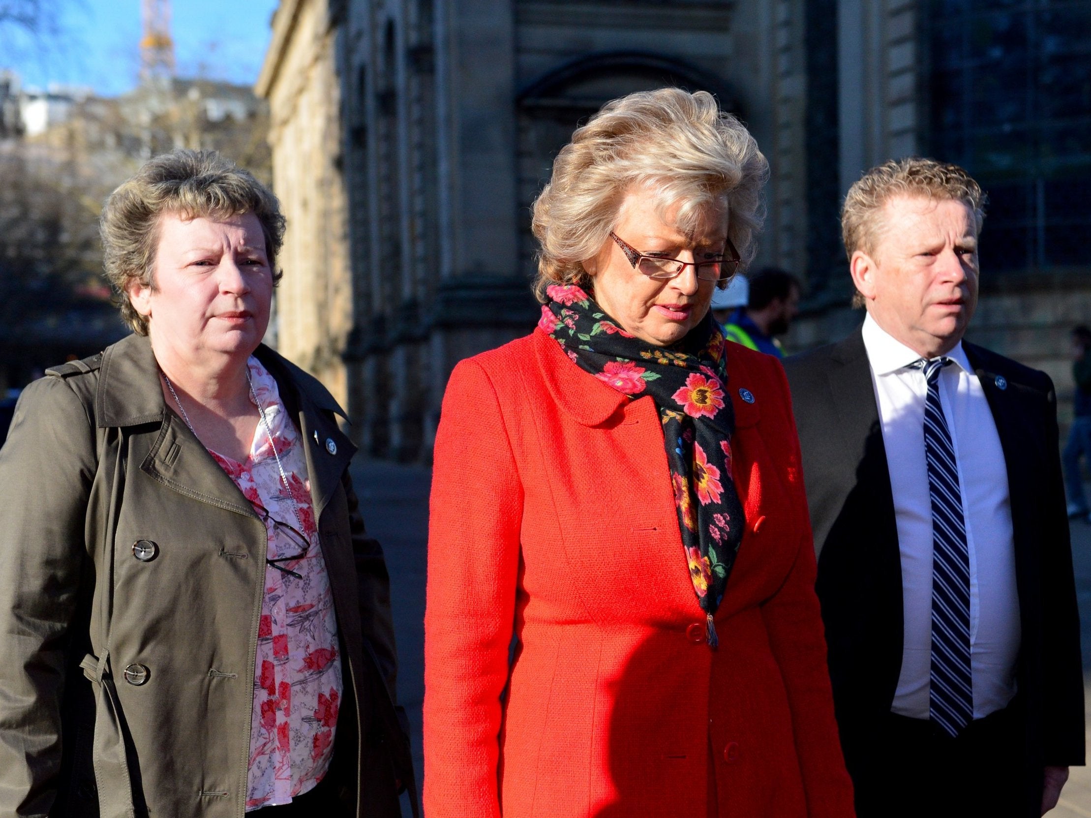 Jayne Hambleton (left), Julie Hambleton and Brian Hambleton, whose sister Maxine was killed in the bombings, arrive for the first day of the inquest (Getty)