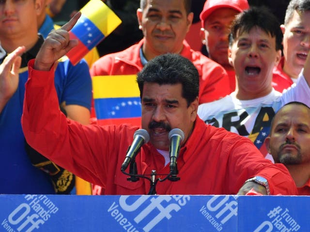 Venezuelan President Nicolas Maduro speaks during a pro-government march in Caracas on 23 February 2019