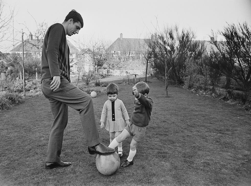 Playing football with his children Debbie and Andrew, 1968