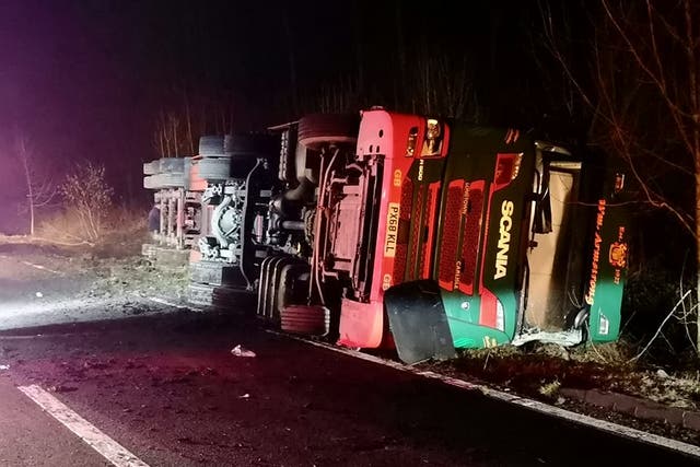The lorry overturned on the A76 near Enterkinfoot, south of Sanquhar, Dumfries and Galloway