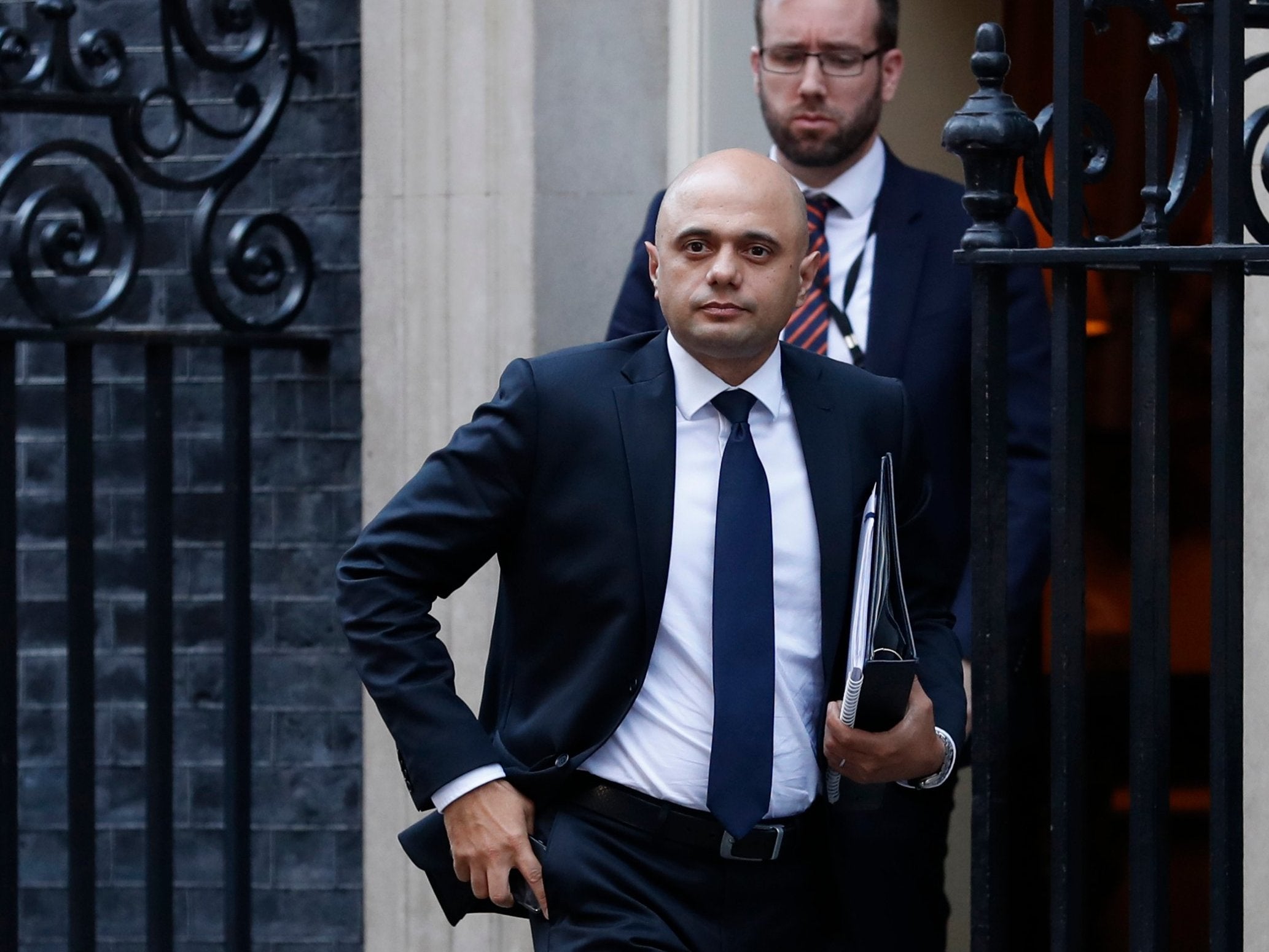‘There have long been calls to ban the whole group with the distinction between the two factions derided as smoke and mirrors,’ says home secretary Sajid Javid