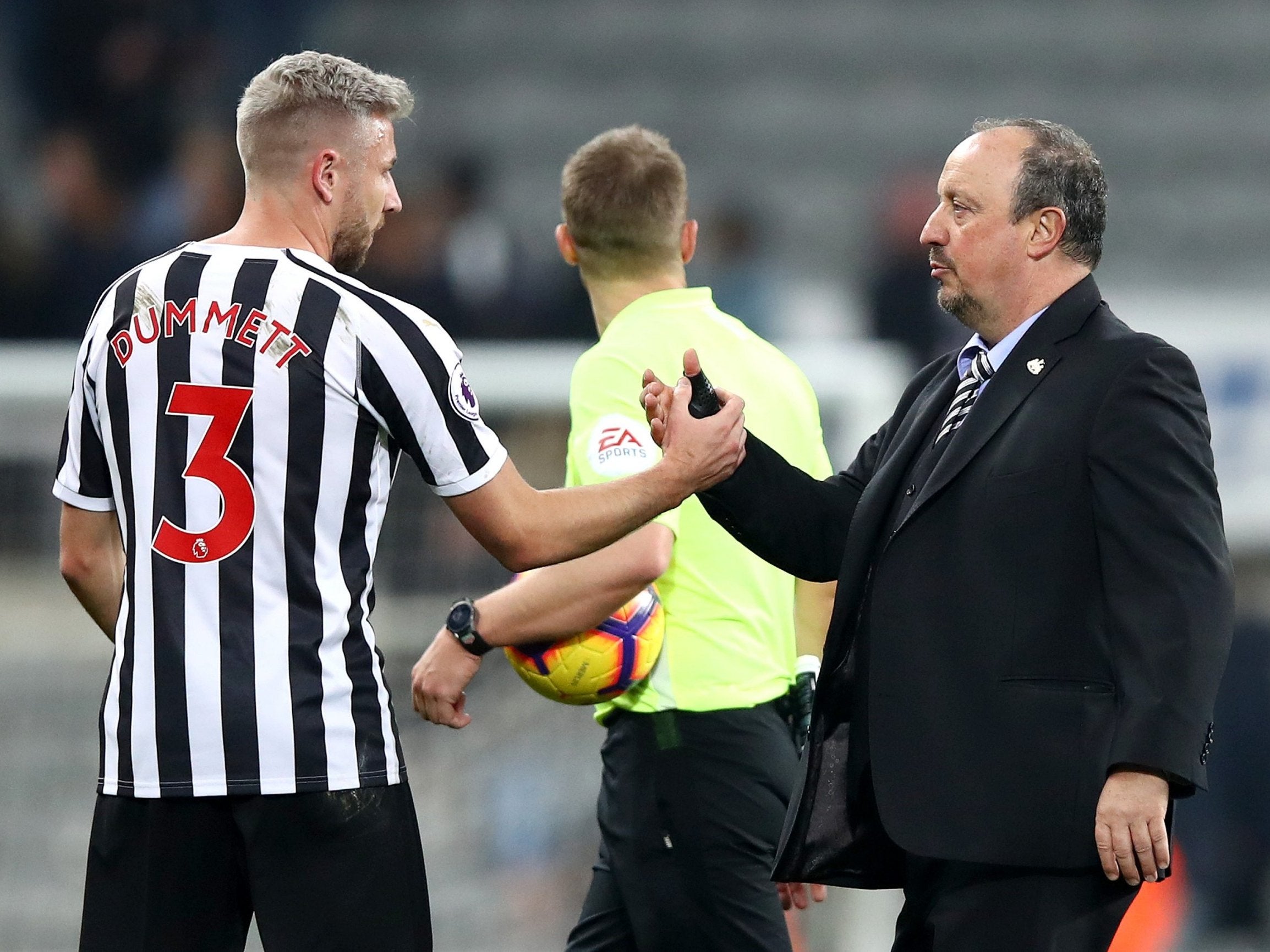 Paul Dummett of Newcastle United shakes hands with Rafael Benitez