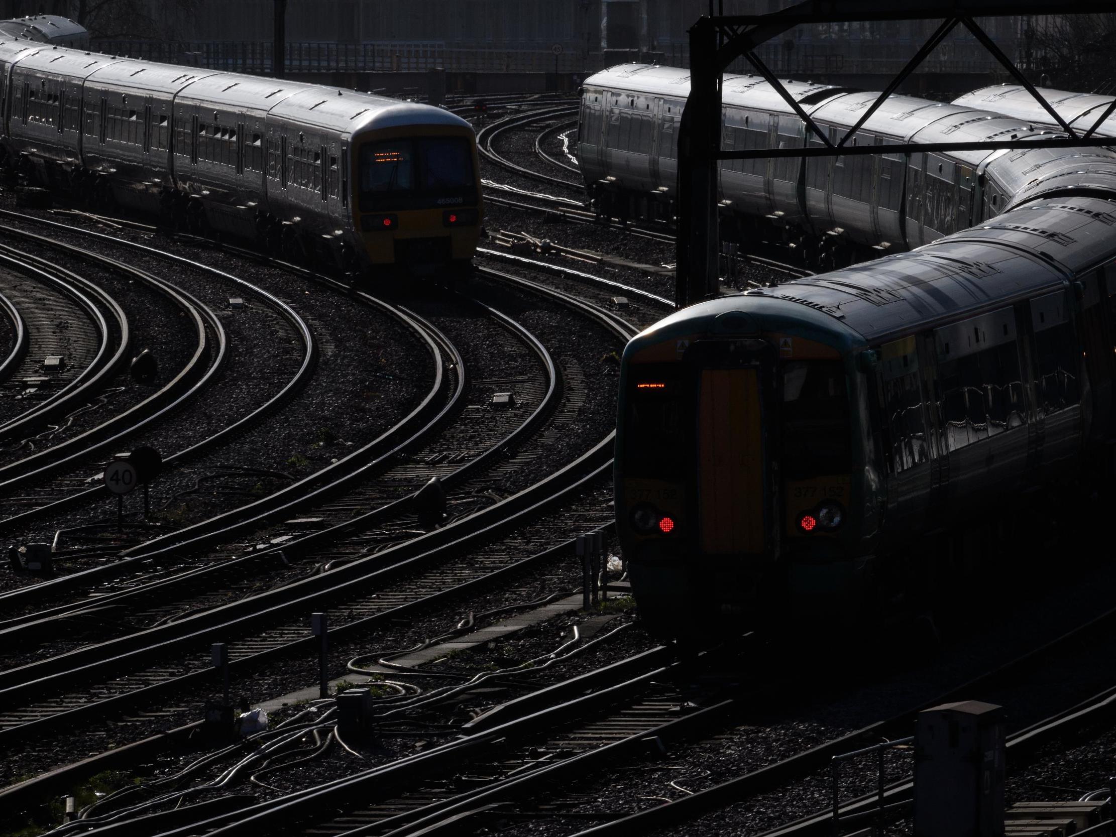 Trains travel on the railway tracks near Victoria Station, London, 16 February 2018