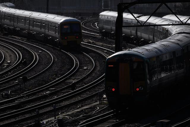 Trains travel on the railway tracks near Victoria Station, London, 16 February 2018
