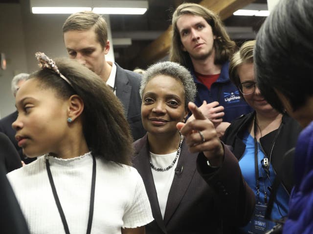 Mayoral candidate Lori Lightfoot and her daughter Vivian Lightfoot appear with supporters at EvolveHer in Chicago Tuesday, Feb. 26, 2019.