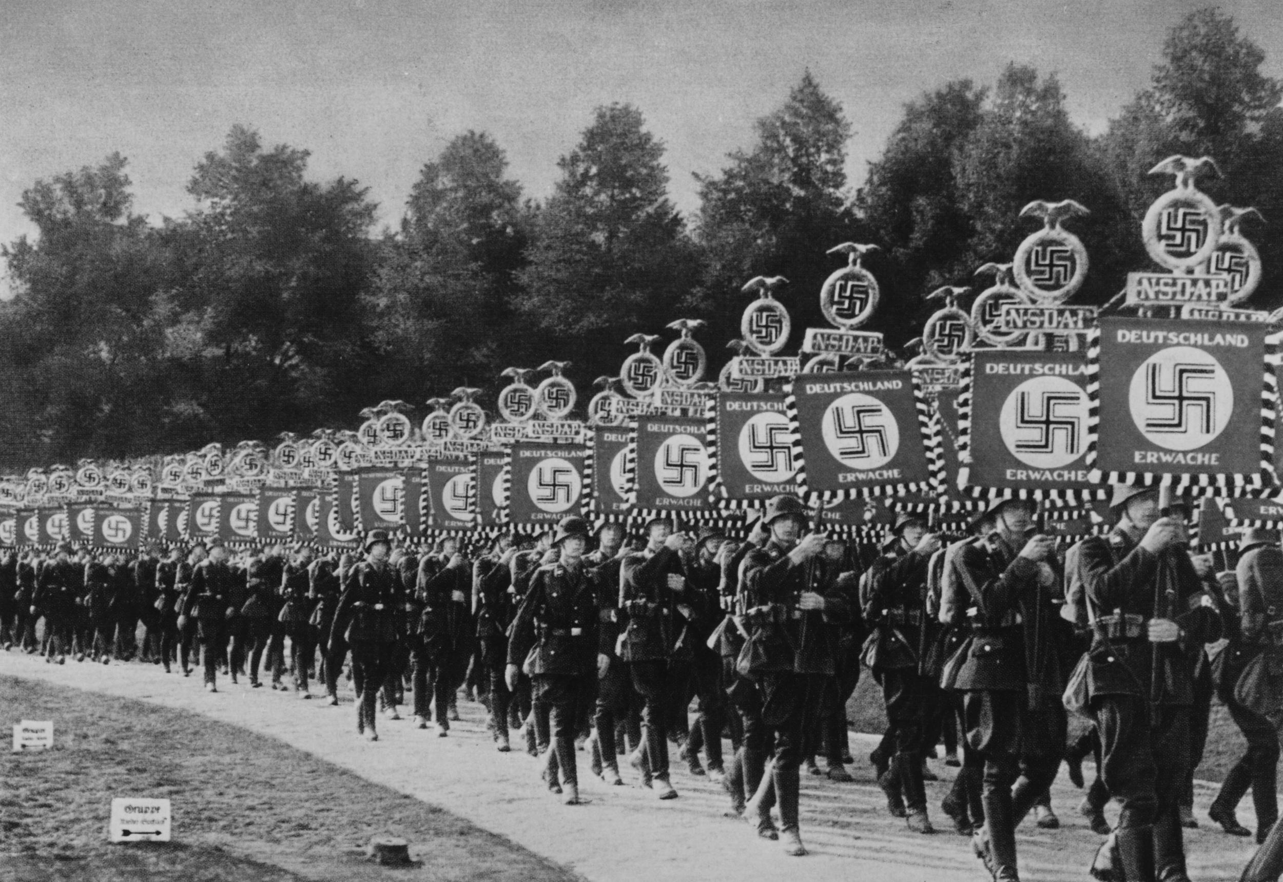 Neo-Nazis filmed marching with torches at Hitler's Nuremberg rally ...