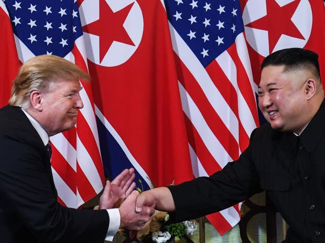 US President Donald Trump shakes hands with North Korea's leader Kim Jong Un following a meeting at the Sofitel Legend Metropole hotel in Hanoi on February 27, 2019.