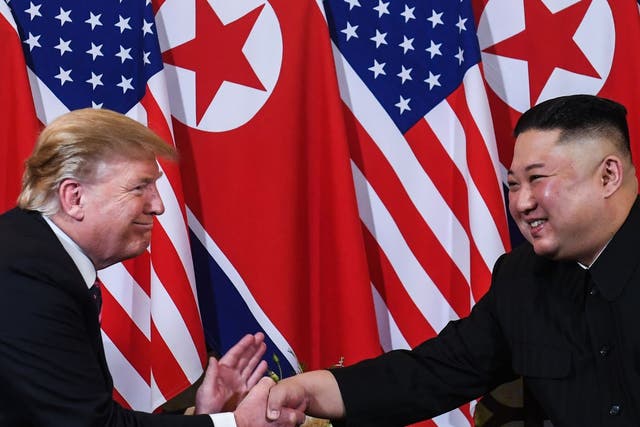 US President Donald Trump shakes hands with North Korea's leader Kim Jong Un following a meeting at the Sofitel Legend Metropole hotel in Hanoi on February 27, 2019.