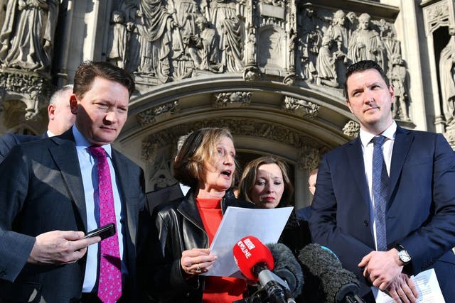 Geraldine Finucane, the widow of murdered Belfast solicitor Pat Finucane, accompanied by her sons John (right) and Michael (left) speaks with reporters outside the Supreme Court in central London, after the family lost a Supreme Court challenge over the decision not to hold a public inquiry into his killing, but won a declaration that an effective investigation into his death has not been carried out