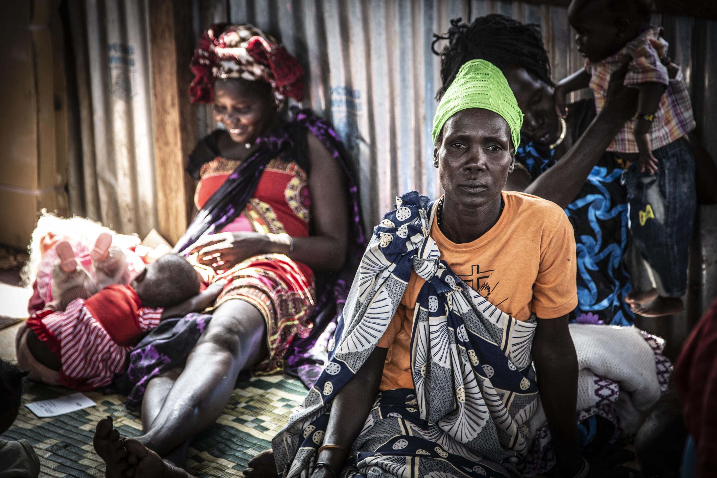 Women wait at a nutrition clinic in a camp for the displaced in Juba, South Sudan