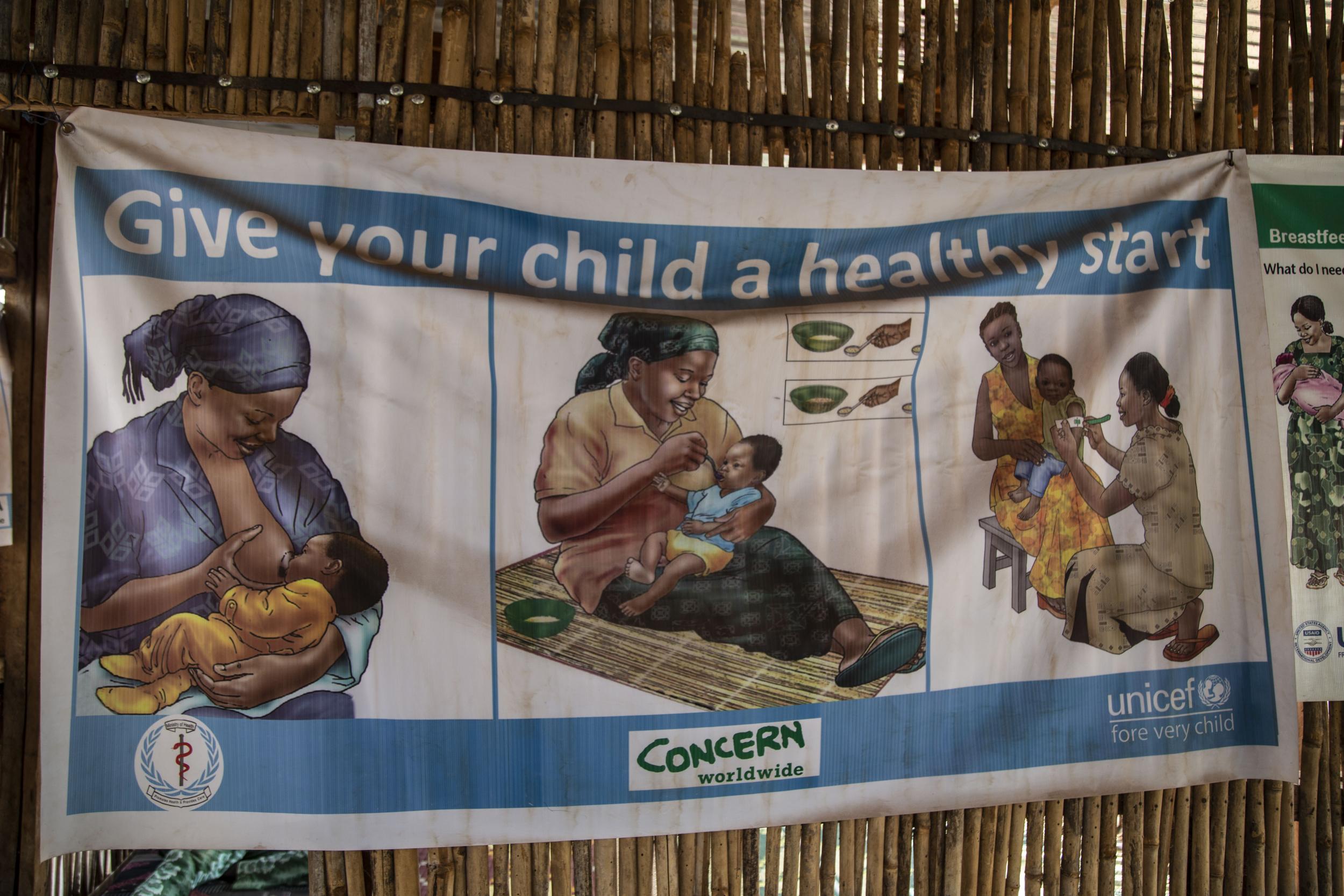Posters at a clinic in POC camp in South Sudan advise mothers on how to keep their babies healthy
