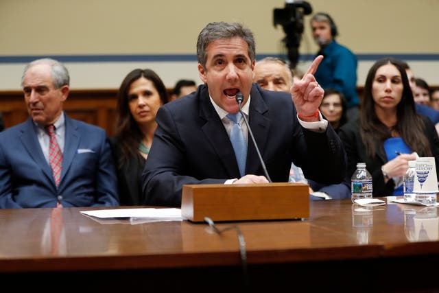 Michael Cohen described Trump as a 'racist', a 'conman' and a 'cheat' during his opening testimony