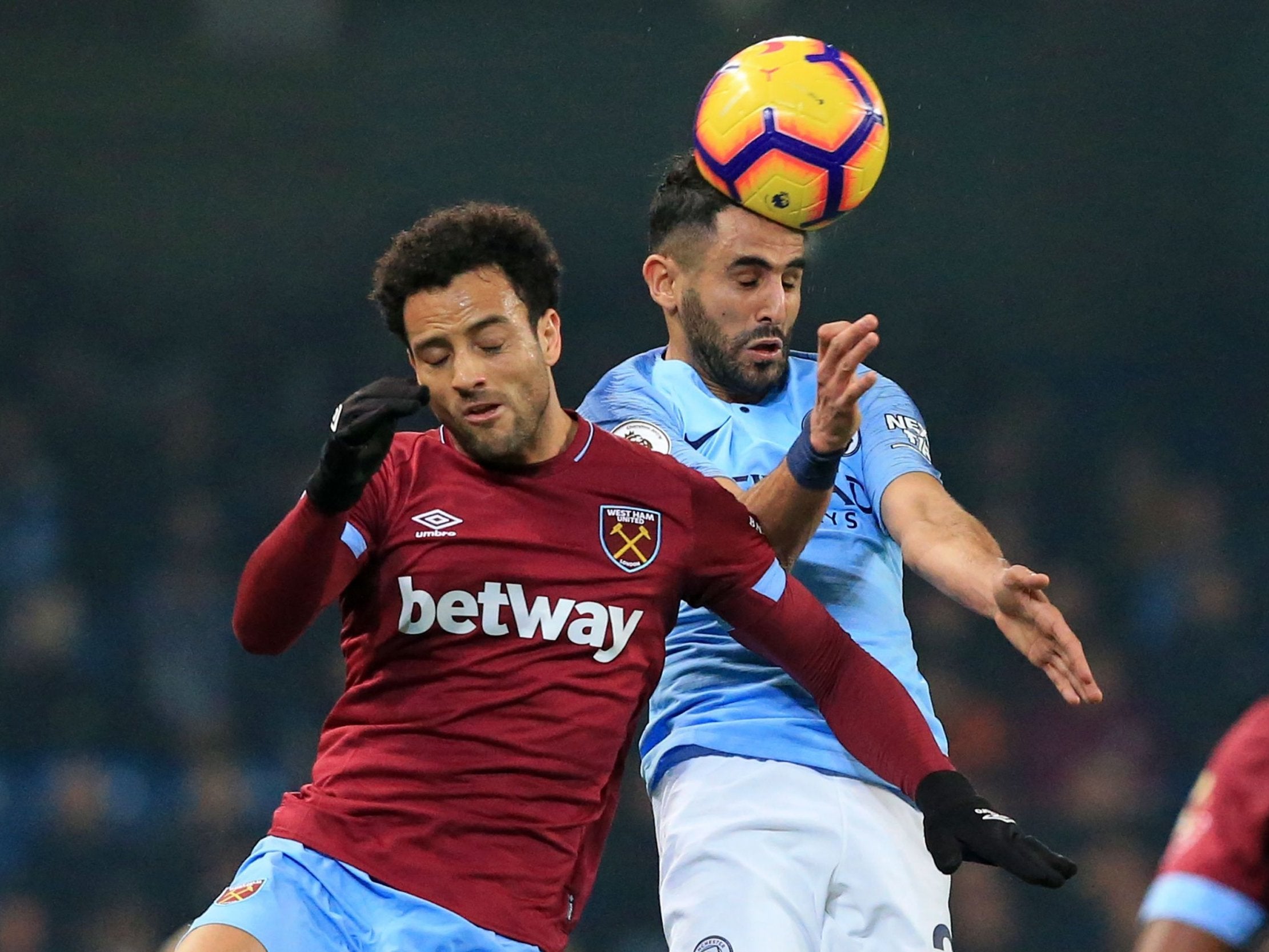 Felipe Anderson and Riyad Mahrez battle for the ball