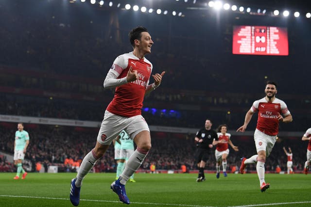 Mesut Ozil celebrates for Arsenal 