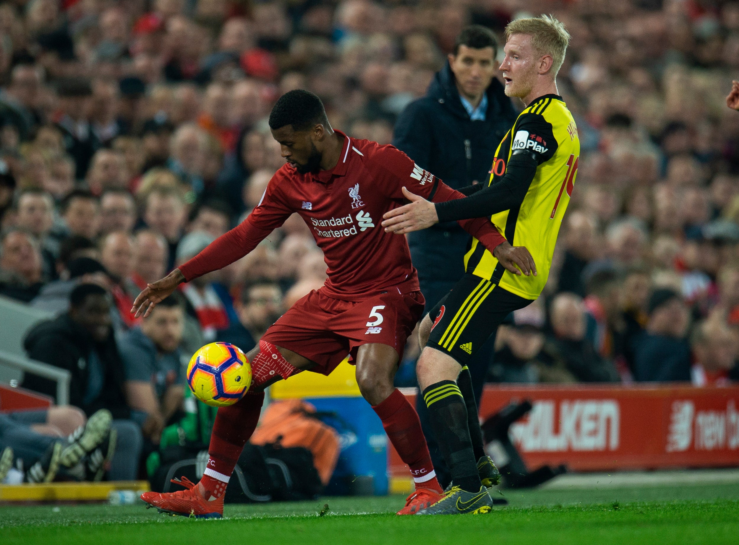 Gini Wijnaldum holds off Willl Hughes