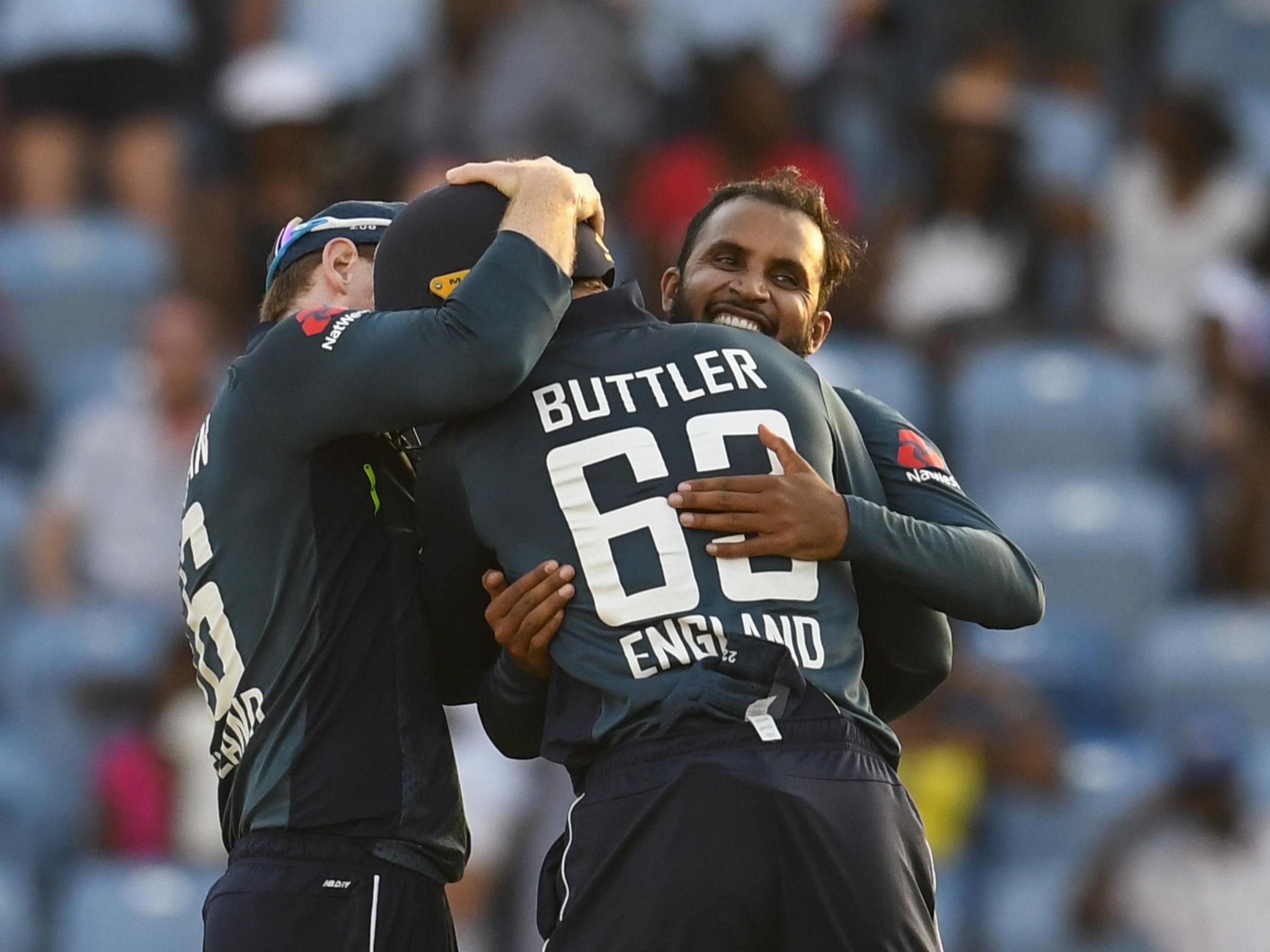 Jos Buttler and Adil Rashid celebrate winning the 4th ODI against the West Indies