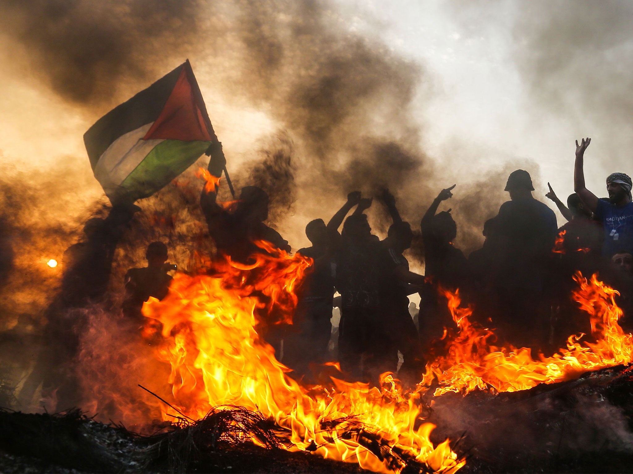 Palestinian protesters demonstrate near the border with Israel in the northern Gaza Strip last October