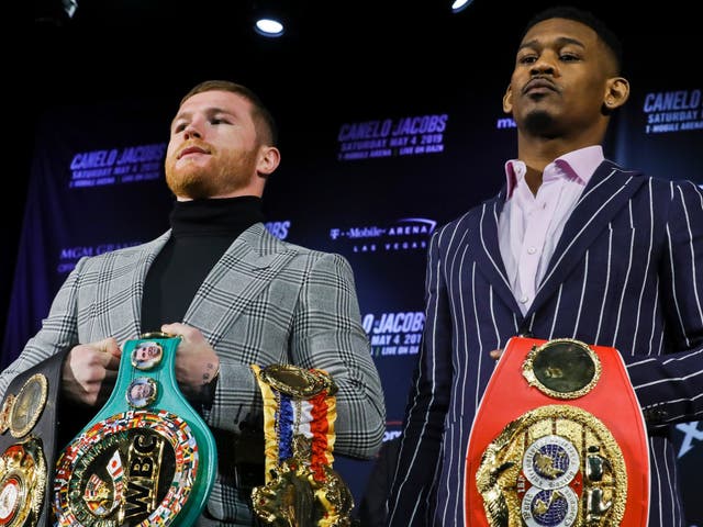 Canelo Alvarez and Danny Jacobs pose with their belts