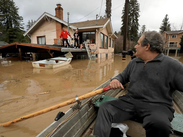 Two Northern California communities are accessible only by boat after rain caused a river to overflow its banks.