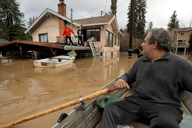 Two Northern California communities are accessible only by boat after rain caused a river to overflow its banks.