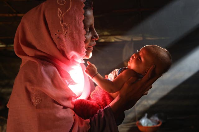 Marjina*, 25, with her two-month-old daughter Asma in Balukhali refugee camp