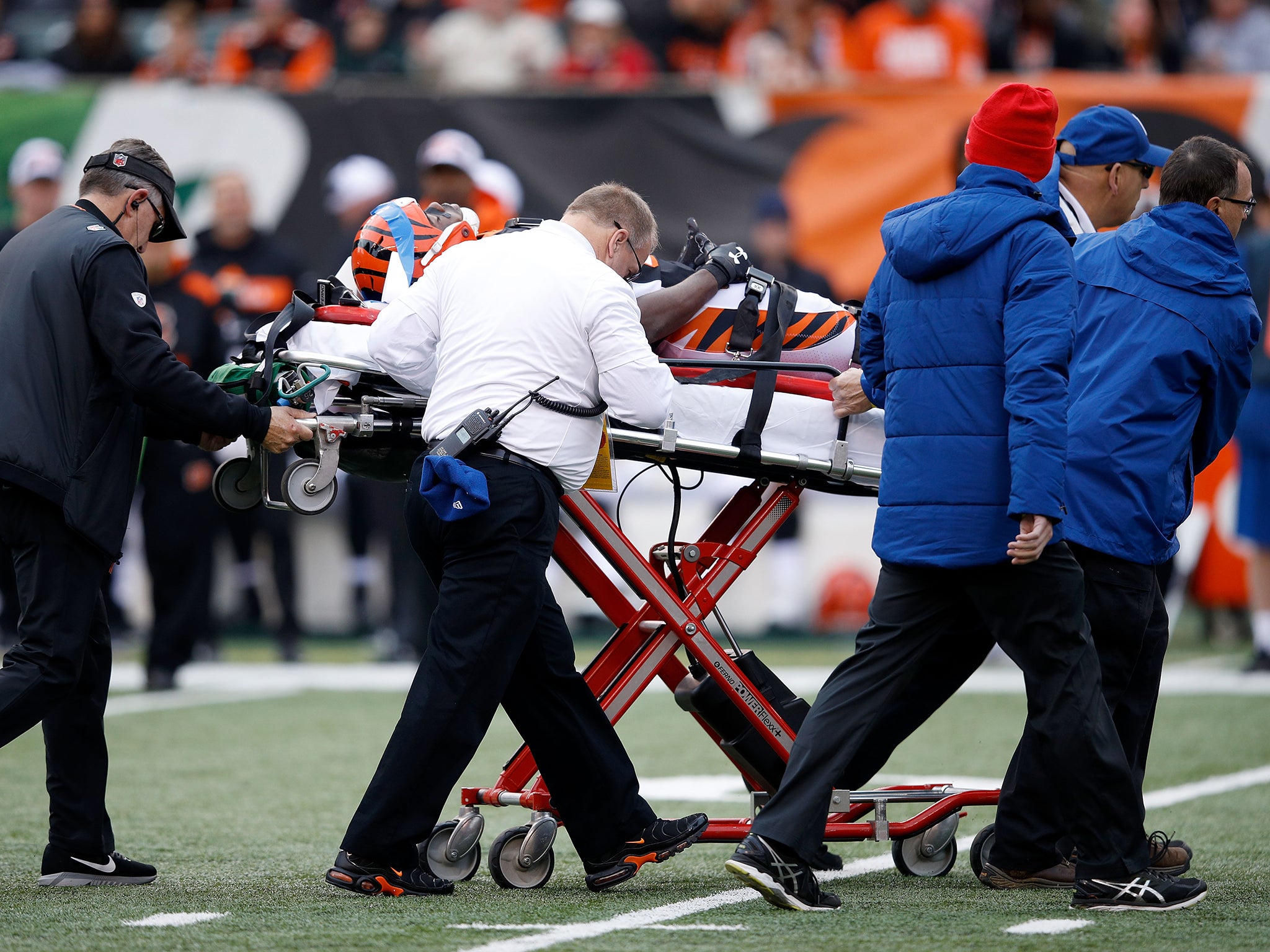 Tony McRae of the Cincinnati Bengals is wheeled off the field after sustaining a concussion during last November’s game against the Cleveland Browns