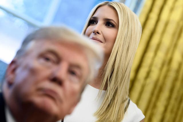 Donald Trump and Ivanka Trump listen during an event to launch the Women's Global Development and Prosperity Initiative in Washington