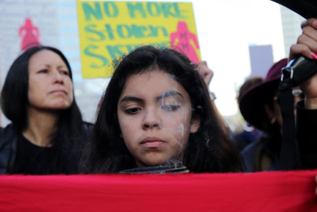 <p>A young activist marches for missing and murdered indigenous women at the Women’s March California 2019</p>