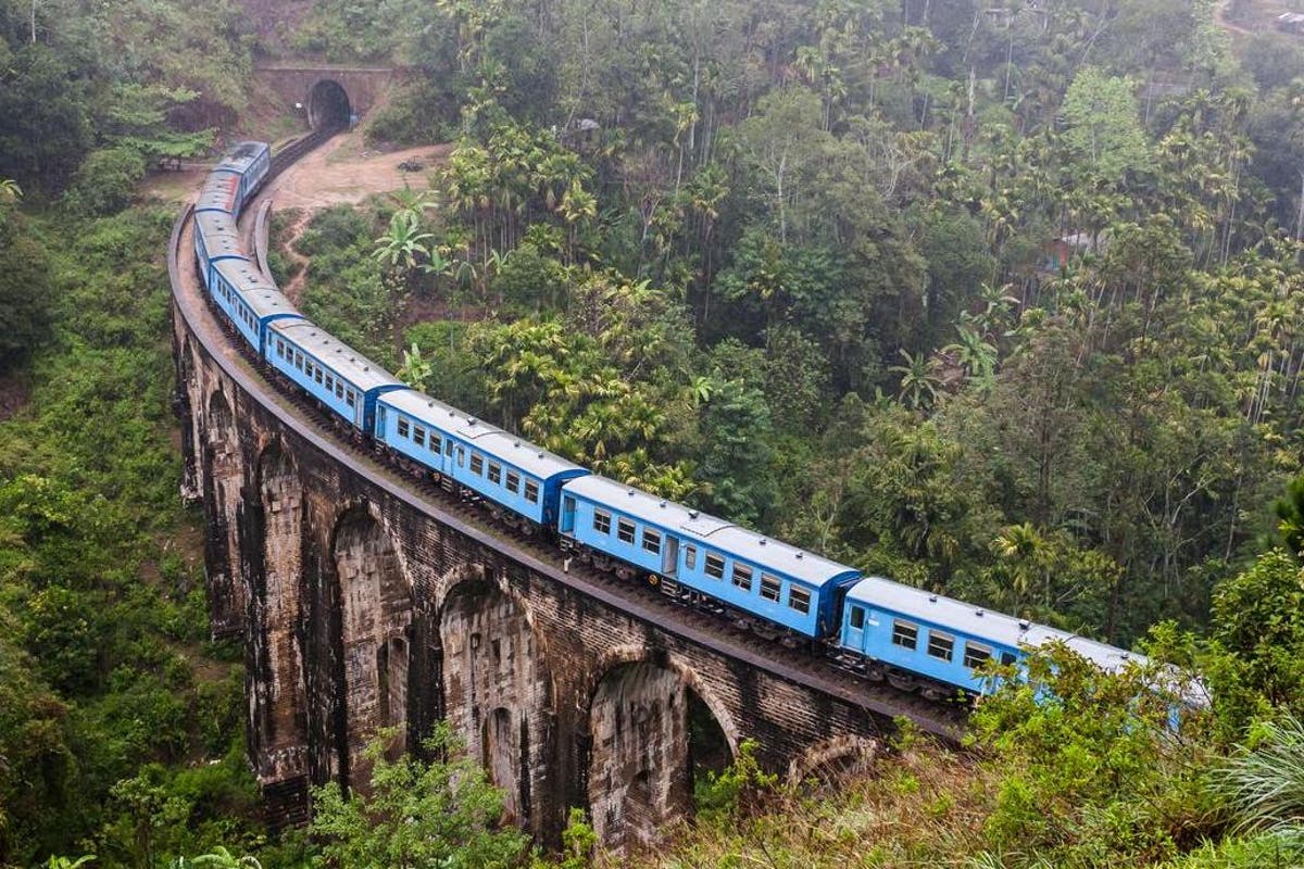 Travel bloggers criticised for hanging out of moving train to get Instagram photo