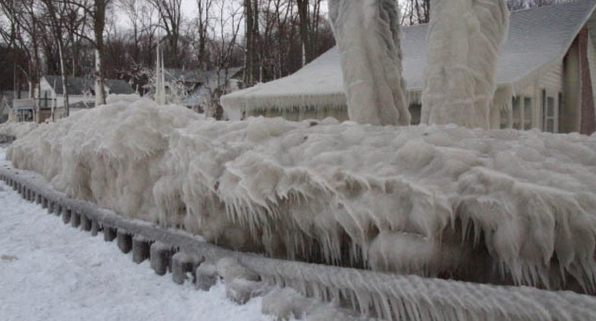 The settled ice is around 4 feet thick and had to pass over a storm barrier to reach the house.